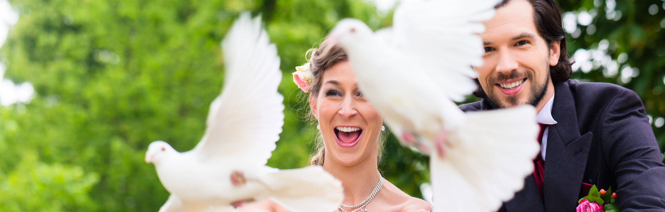 33790663 - bridal pair with flying white doves at wedding